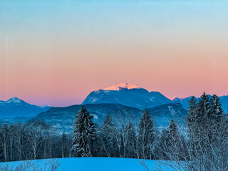 Twilight atmosphere on majestic snow-capped mountain summit Dobratsch in Gailtal Alps seen from...