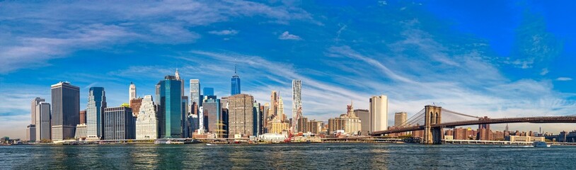 Naklejka premium Lower Manhattan Panorama, Iconic Skyline of New York City at Sunset