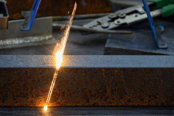 Close up scene rust cleaning process by portable laser cleaning machine.
