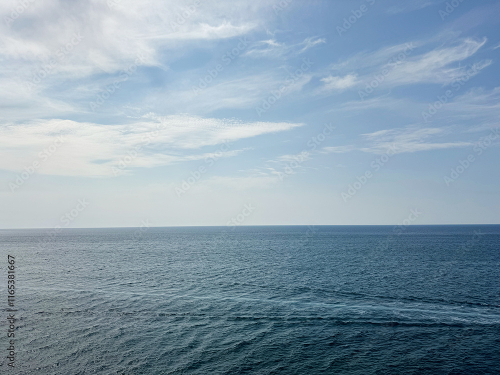 Poster Open sea calm water and sky clouds horizon.