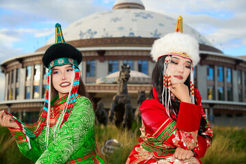 Two Mongolian girls wearing traditional Mongolian tribal costumes