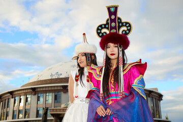 Two Mongolian girls wearing traditional Mongolian tribal costumes