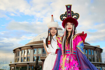 Two Mongolian girls wearing traditional Mongolian tribal costumes