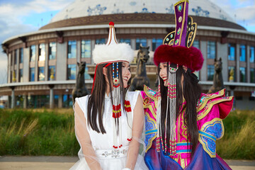 Two Mongolian girls wearing traditional Mongolian tribal costumes