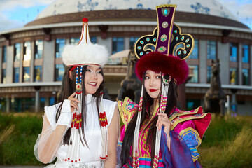 Two Mongolian girls wearing traditional Mongolian tribal costumes