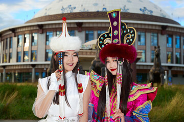 Two Mongolian girls wearing traditional Mongolian tribal costumes