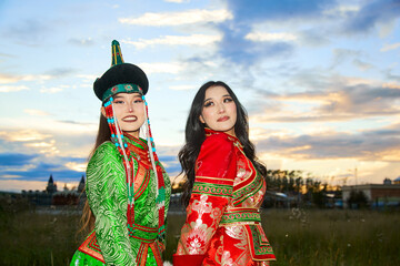 Two Mongolian girls wearing traditional Mongolian tribal costumes
