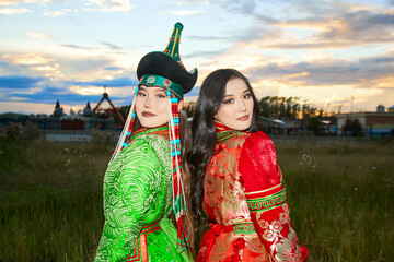 Two Mongolian girls wearing traditional Mongolian tribal costumes
