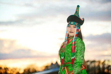 Mongolian girl wearing gorgeous traditional costumes of Mongolian tribe