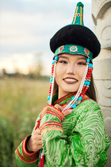 Mongolian girl wearing traditional costumes of the Barhu tribe
