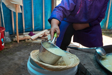 The process of making milk tofu using traditional techniques in a yurt