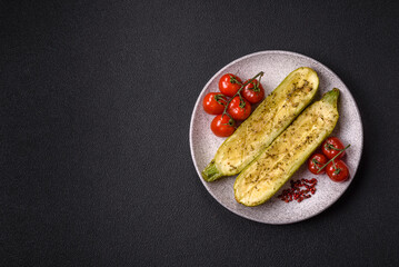 Delicious zucchini cut into two halves baked with salt, spices and herbs