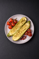 Delicious zucchini cut into two halves baked with salt, spices and herbs