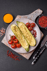 Delicious zucchini cut into two halves baked with salt, spices and herbs