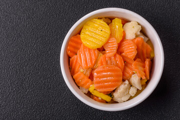 Delicious fresh vegetables steamed carrots, broccoli, cauliflower