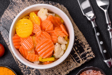Delicious fresh vegetables steamed carrots, broccoli, cauliflower