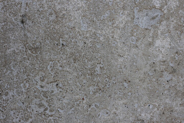 Gray concrete wall artificial building material with small holes