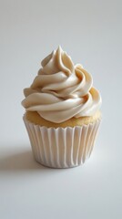 A Delectable Vanilla Cupcake with Exquisite Cream Topping