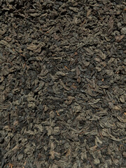 Dry raw black tea close up.
