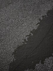 Melting snow creating abstract shapes on pond in prague Nature park Smetanka