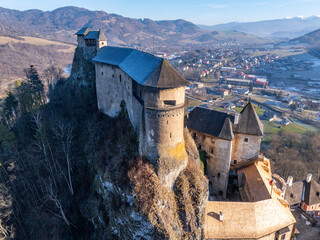 Aerial view of the Orava castle at winter, Slovakia. Medieval Oravsky Hrad castle on high and steep cliffs by the Orava River.