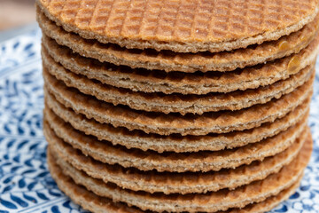 Traditional Dutch sweet dessert, Butter caramel syrup waffles, fresh baked