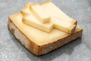 French cheese Comte, varieties unpasteurised ed milk Prestige, fruity flavoured Fruite and Vieille Reserve close up