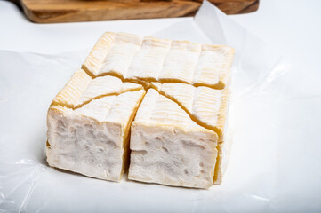 French squared pont l'eveque cow cheese from Calvados department, Normandy, France
