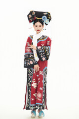 Girl wearing Chinese Qing Dynasty court costume on white background