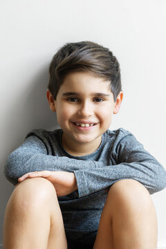 8 year old Spanish child boy sitting happy and smiling
