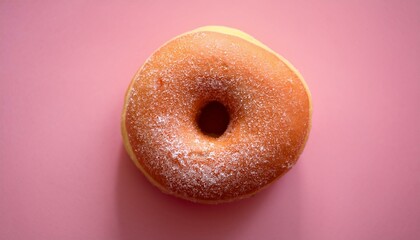シンプルで穏やかな淡いピンクの背景に、シュガーコーティングされたドーナツが一つだけ置かれ、甘さが引き立つナチュラルなシーン
