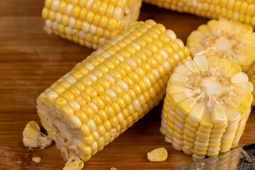 pieces of sweet corn for cooking and cooking with juicy yellow grains
