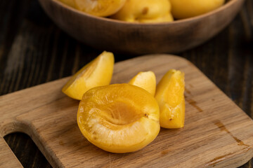 ripe soft apricot fruits on the cutting board