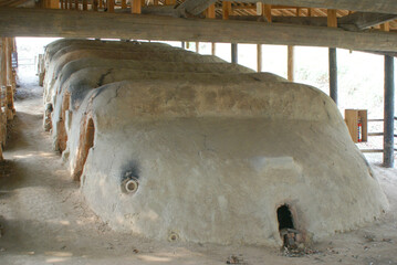 Traditional Japanese noborigama kiln in Mashiko, used for firing ceramics and porcelain, featuring a stepped design, clay structure, and historic pottery techniques.