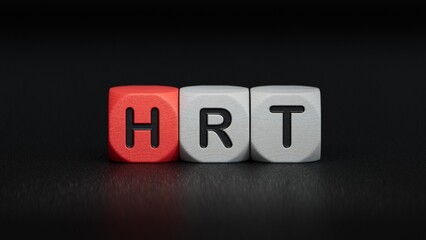 HRT the word is written on wooden cubes.close up of wooden elements,Business Concept.3D rendering on black background.