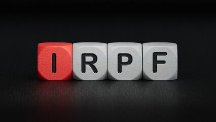 IRPF text on wooden block.close up of wooden elements,Business Concept.3D rendering on black background.
