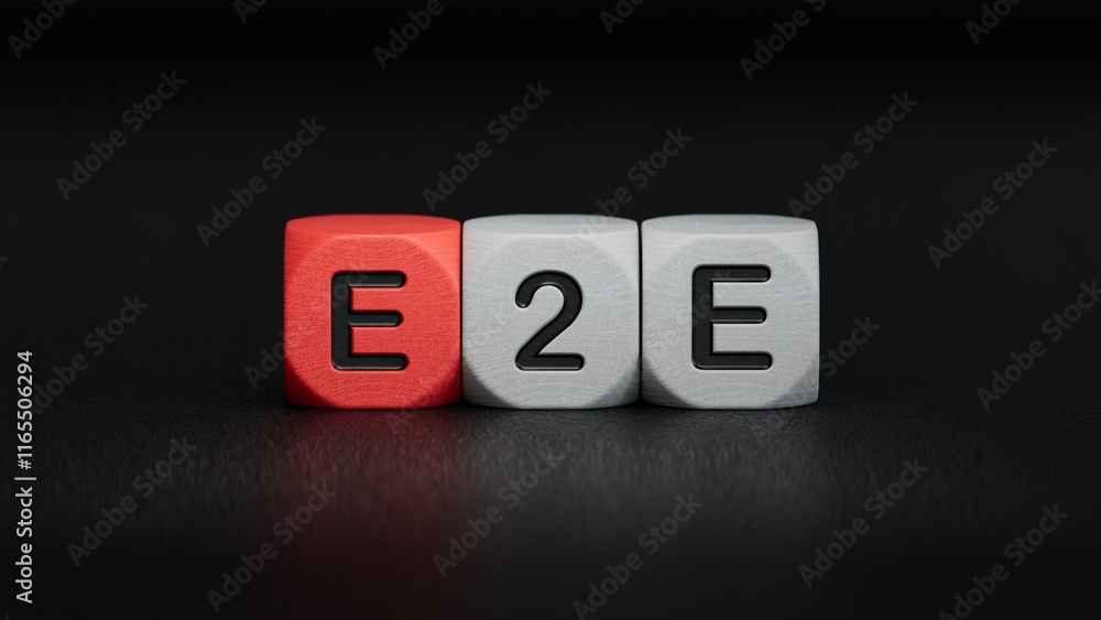 Aufkleber text e2e is written on wooden cubes standing in a row. around the blocks with letters. can be used f