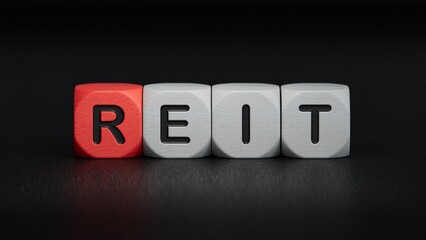 Word reit on wooden cubes with copy space.close up of wooden elements,Business Concept.3D rendering on black background.