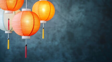 Obraz premium Vibrant Lanterns Hanging Against Textured Background