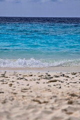 waves on a white tropical island beach
