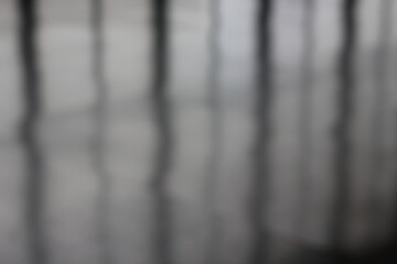A dreamy view of reflections on the shiny floor.