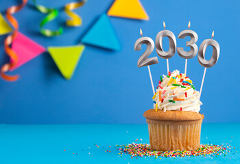 Happy New Year 2030 - Candles in the form of burning numbers on a blue background