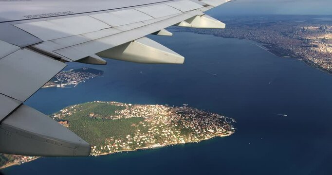 A stunning video captured from an airplane window, showcasing the breathtaking Marmara Sea and the Princes' Islands as the plane takes off over Istanbul.