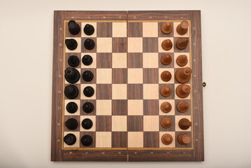 Black and white chess. Wooden chess on a board. A chess game.