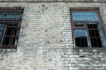 old abandoned brick building with broken windows