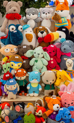 A large collection of stuffed animals, including teddy bears, rabbits, and foxes