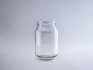 Empty transparent glass jar isolated on a white background
