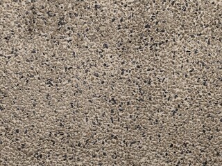 The texture of the wall is made of pebbles.