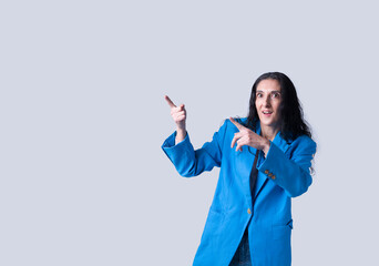 Caucasian woman isolated on gray background pointing up and surprised
