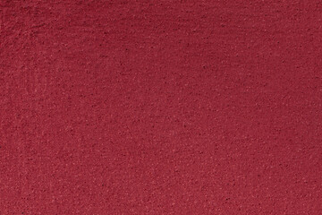 Deep Red Texture: Minimalist Speckled Surface